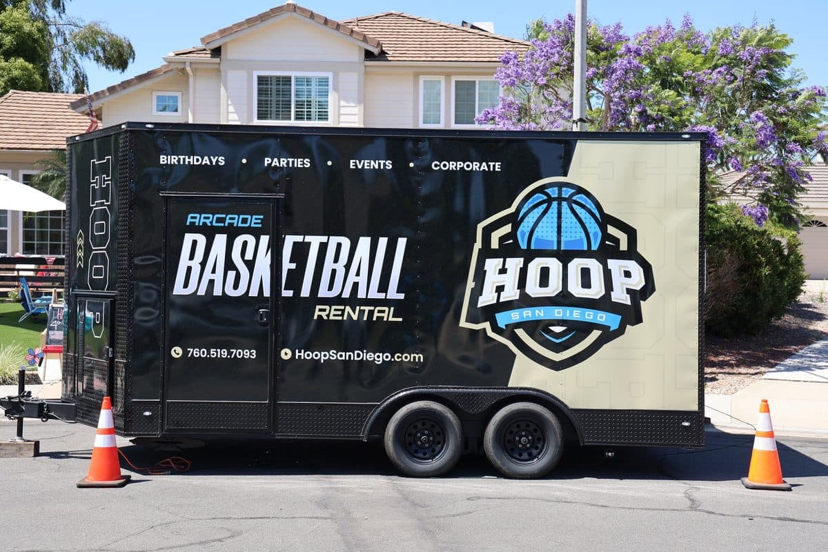 Hoop San Diego arcade basketball trailer parked curbside, ready for an event