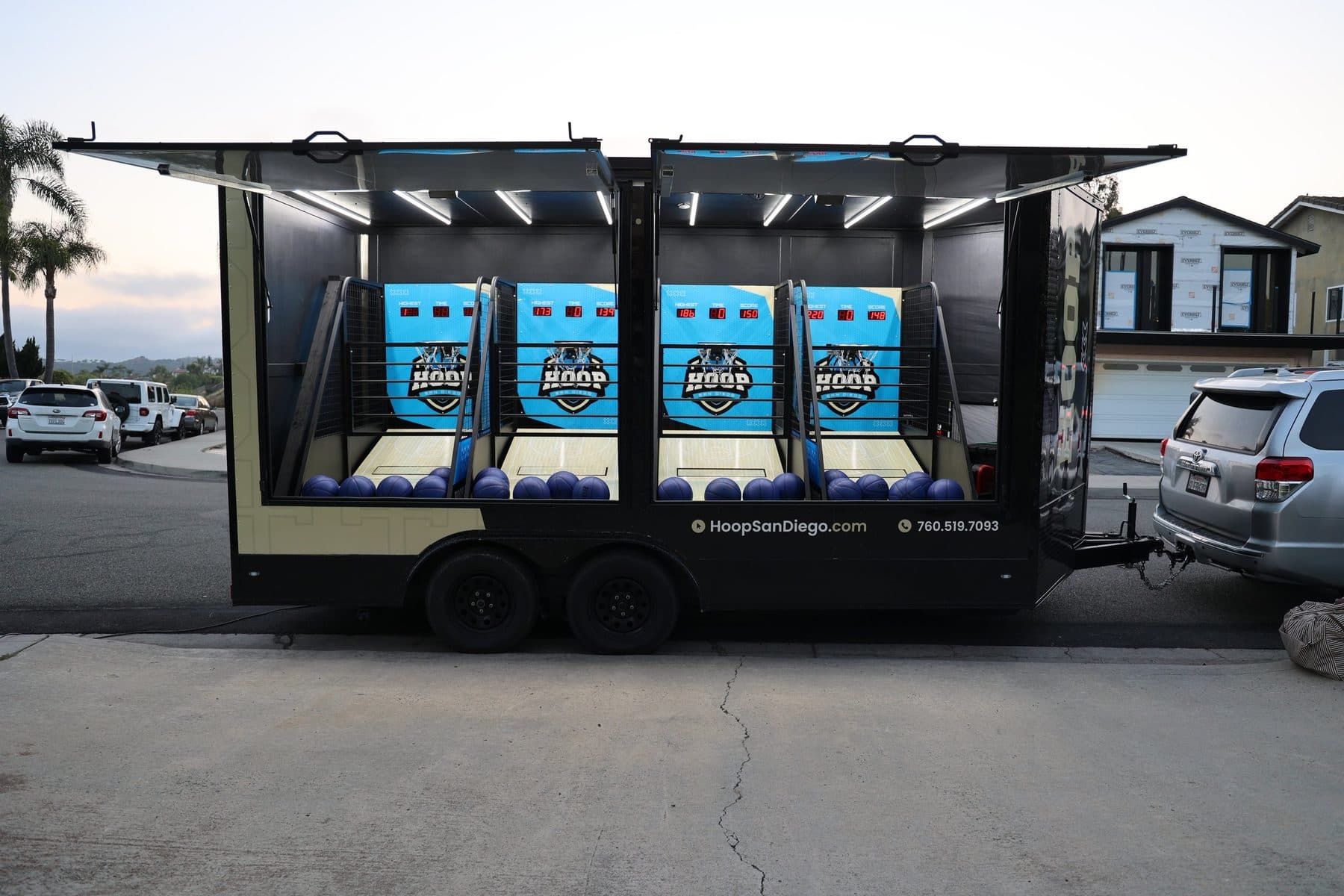 Hoop San Diego arcade trailer fully open with all four basketball games ready